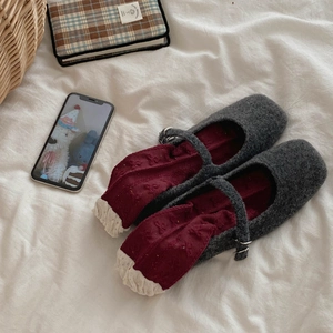 Close-up of wool Mary Jane shoes with retro red polka dot socks in a lifestyle setting