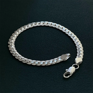 Elegant silver plated braided chain bracelet with lobster clasp on dark background