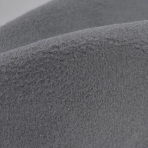 Detailed macro view of soft grey wool felt fabric texture on a flat top fedora hat