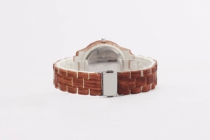 Detail view of the brown and beige wood grain texture watch band with metal clasp