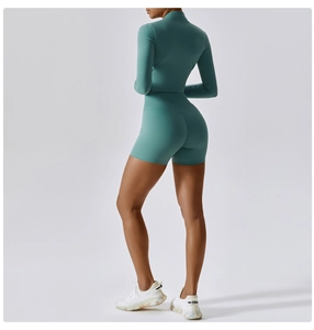 Rear view of tight yoga set with long sleeve zipper top and high waist shorts