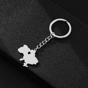 Macro view of steel keychain with heart-shaped cutout in the country map pendant