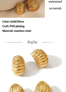 Macro detail of wave textured gold stainless steel earrings with waterproof PVD plating