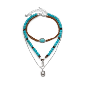 Detailed view of bohemian layered necklace with turquoise beads and western charms