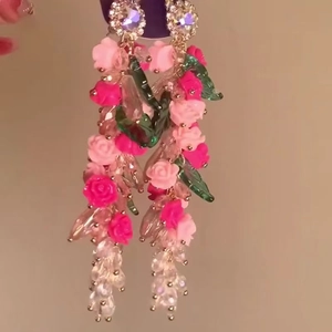 Pink and magenta flower stud earrings with green leaves and crystal bead charms