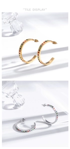 Detailed tile display of gold and silver C-shaped earrings with colorful pave crystals