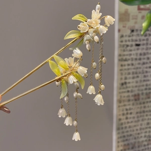 Elegant gold Lily of the Valley hairpins with long tassels and translucent flower petals