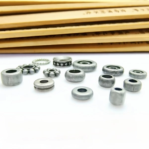 Detail of dark grey iron-colored alloy spacer beads for DIY Buddhist jewelry crafting