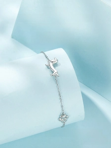 Detail shot of s925 sterling silver dachshund dog and paw charm bracelet