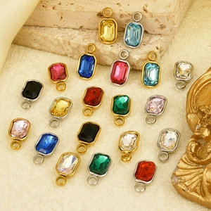Detailed view of colorful rectangular glass crystal pendants with gold and silver plated edges