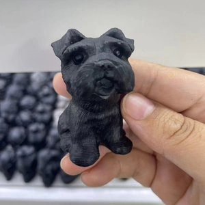 Handheld matte black obsidian Schnauzer puppy figurine made of resin stone craft