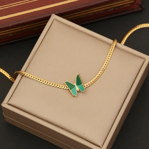 Elegant gold flat snake chain necklace with a vibrant green enamel butterfly pendant