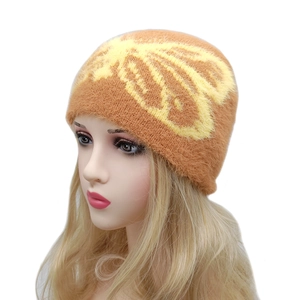 Winter fluffy knit beanie hat with butterfly pattern in caramel brown and yellow jacquard