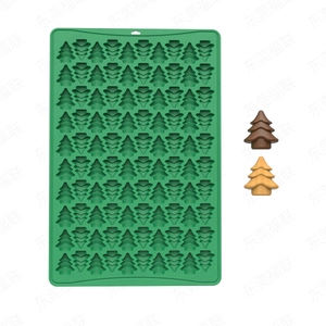 Detailed view of green silicone mold with 70 cavities for Christmas tree shaped chocolates