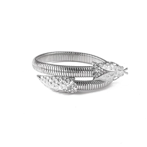 Macro detail of silver snake bracelet with crystal scales and flexible coiled texture