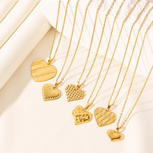 Elegant 18k gold plated heart pendants with various textures on a minimalist background