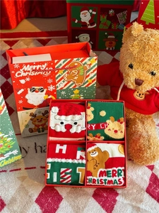 Detail of Christmas gift set with four pairs of combed cotton socks in a festive box