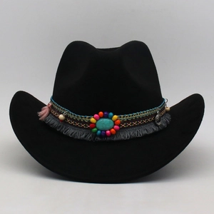 Detail of black felt cowboy hat featuring ethnic beaded band and turquoise stone accent