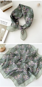Detail of green floral cotton linen square scarf with daisy pattern for hair and neck