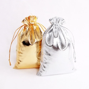 Golden and silver metallic drawstring pouches for jewelry and luxury gift packaging