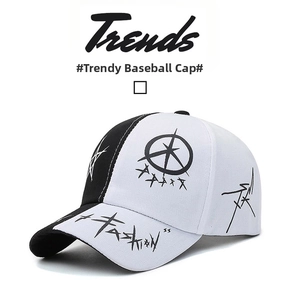 Detail view of black and white baseball cap with graffiti stars and Fashion text