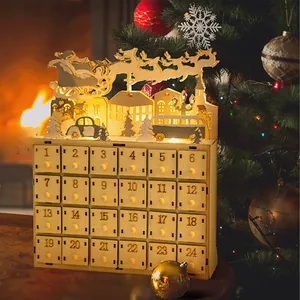 Close-up of wooden Advent calendar with 24 drawers and LED backlit Santa silhouette