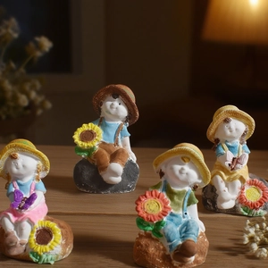 Four cartoon children figurines with straw hats and sunflowers for home garden decor