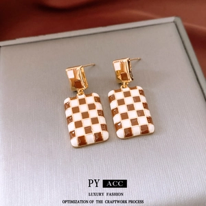 Elegant gold-plated rectangular drop earrings with brown and white checkerboard enamel pattern