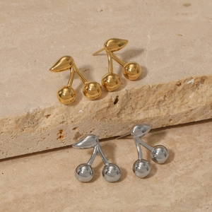 Polished stainless steel cherry stud earrings in gold and silver finish with leaf detail