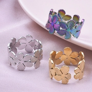 Three-piece set of adjustable floral rings in gold, silver and rainbow stainless steel