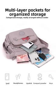Detail view of the multi-pocket nylon crossbody bag showing its large storage capacity