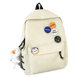 Minimalist cream canvas student backpack with badges and a cute plush duck keychain