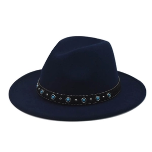 Detailed close-up of navy wool fedora hat with turquoise beads and silver metal studs
