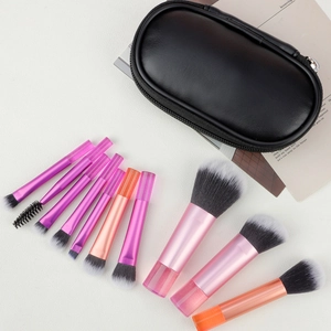 Detail of 10pcs travel makeup brush set with pink gradient handles and black storage case
