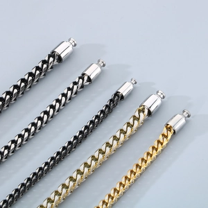 Detail of multi-color stainless steel dragon bone chains and cylinder snap buckles