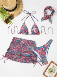 Detailed flat lay of 4-piece paisley bikini set with drawstring skirt and headband