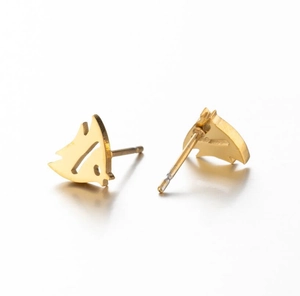Detailed close-up of golden animal outline stud earrings with smooth metallic finish