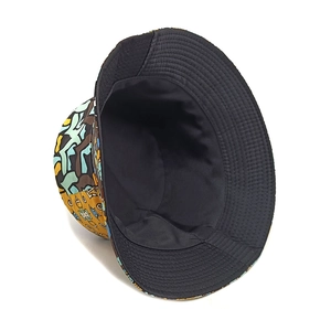 Detail of double-sided sun hat with geometric tribal print and reinforced brim stitching