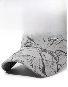 Close-up of the stiff brim and embroidered mountain sport logo on the grey baseball cap