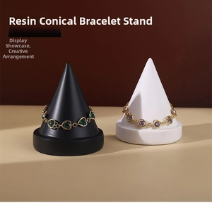 Macro detail of black and white resin cone stands for bracelet and jewelry display