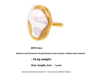 Detailed view of large baroque pearl on a gold irregular stainless steel ring band