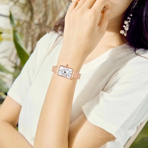 Women's rose gold rectangular quartz watch with mesh band and Arabic numeral dial