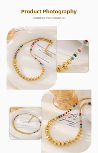 Close-up detail of multi-color stone beads and 18k gold plated irregular metal beads necklace