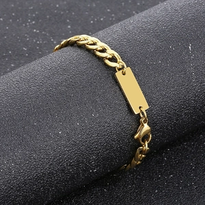 Detailed view of a 7mm gold stainless steel Cuban chain necklace with blank engravable plate