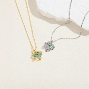 Detailed close-up of heart pendants featuring iridescent shell inlay and white zircon stones