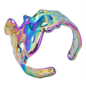 Detail of irregular liquid lava ring with iridescent rainbow finish and open design