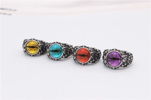 Detailed view of gothic dragon eye rings in four colors with vintage scale textures