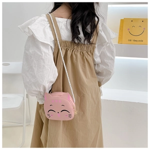 Detail of pink cat-shaped toddler purse with braided strap and heart embroidery