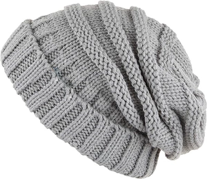 Detailed close-up of dark grey knitted beanie showing thick textured rib pattern