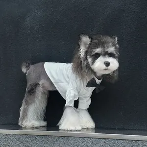 Formal white pet shirt with black bow tie for dogs featuring classic button design
